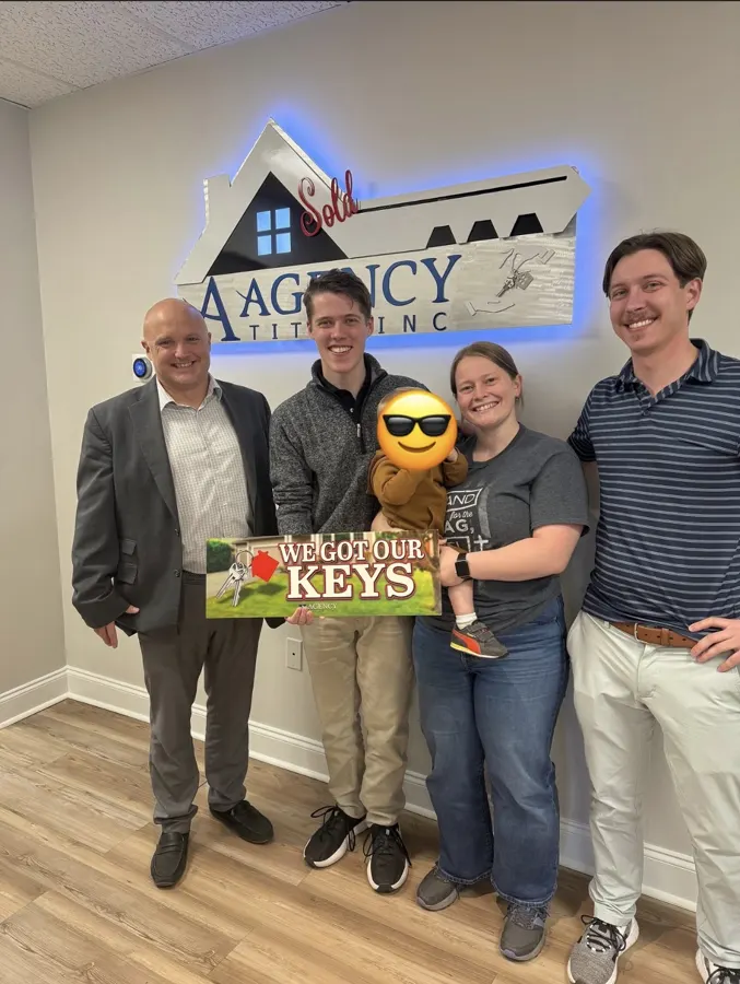 Spencer Lowe with Louisville clients on closing day
