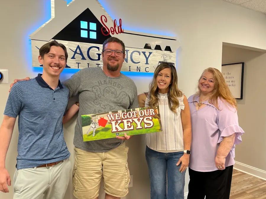 Spencer Lowe with Louisville clients on closing day