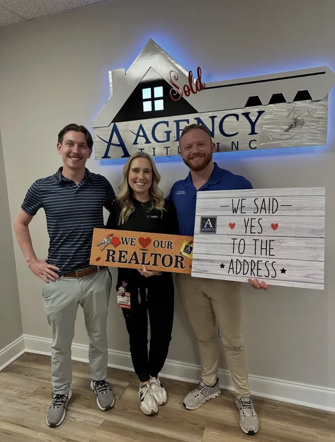 Spencer Lowe with Louisville clients on closing day