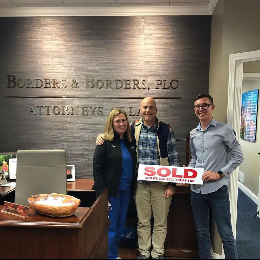 Spencer Lowe with Louisville clients on closing day