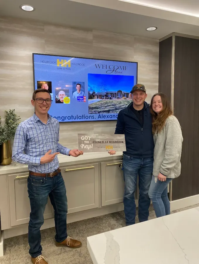 Spencer Lowe with Louisville clients on closing day