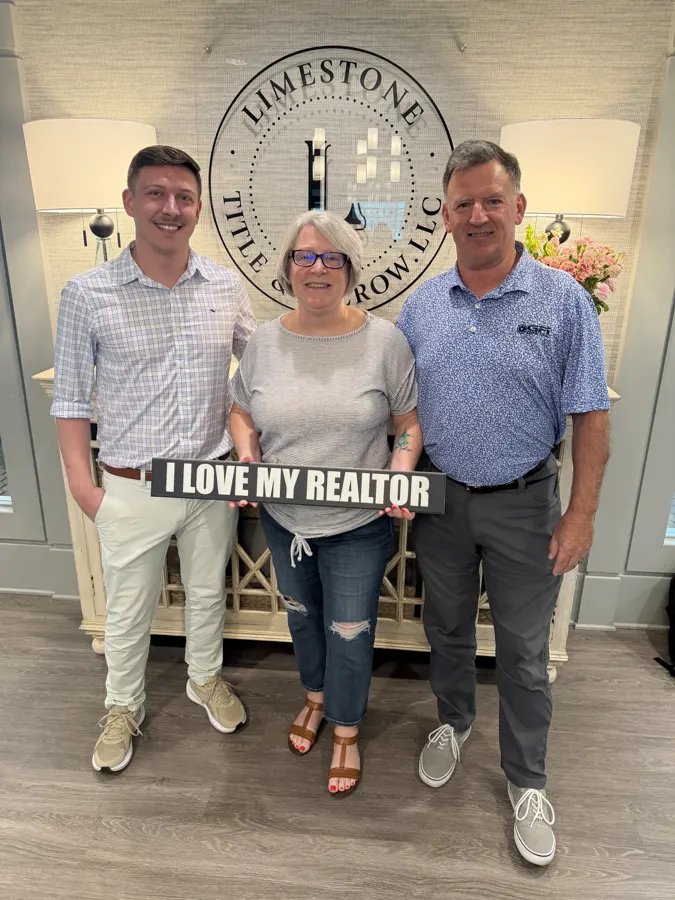 Spencer Lowe with Louisville clients on closing day