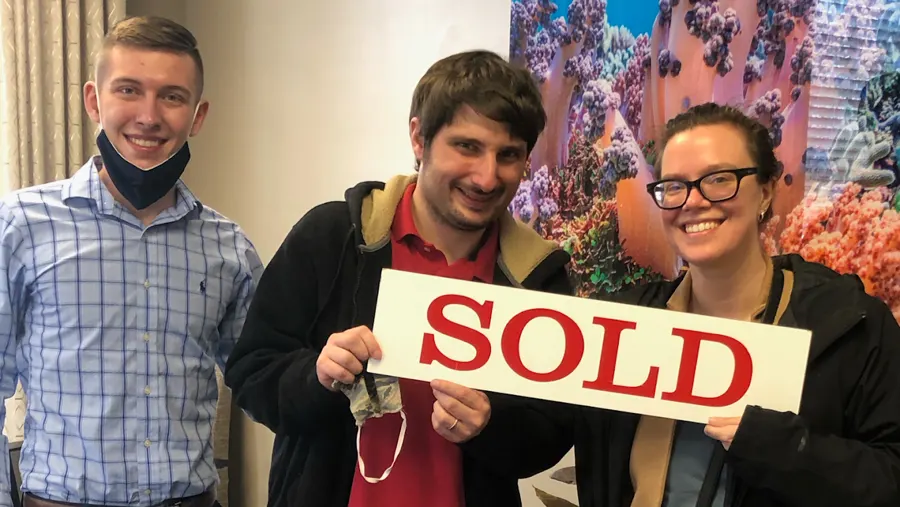 Spencer Lowe with Louisville clients on closing day